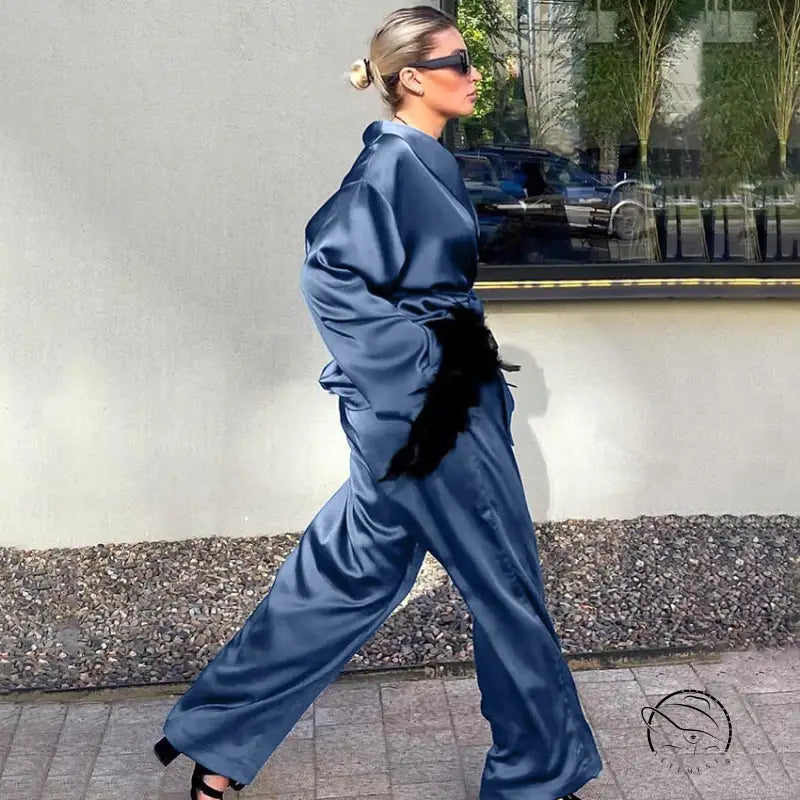 Langry fashion blue satin jumpsuit with black fur belt and high heels ملابس