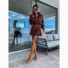 Woman in brown patterned romper from the Elegant Office Set with lace shorts suit