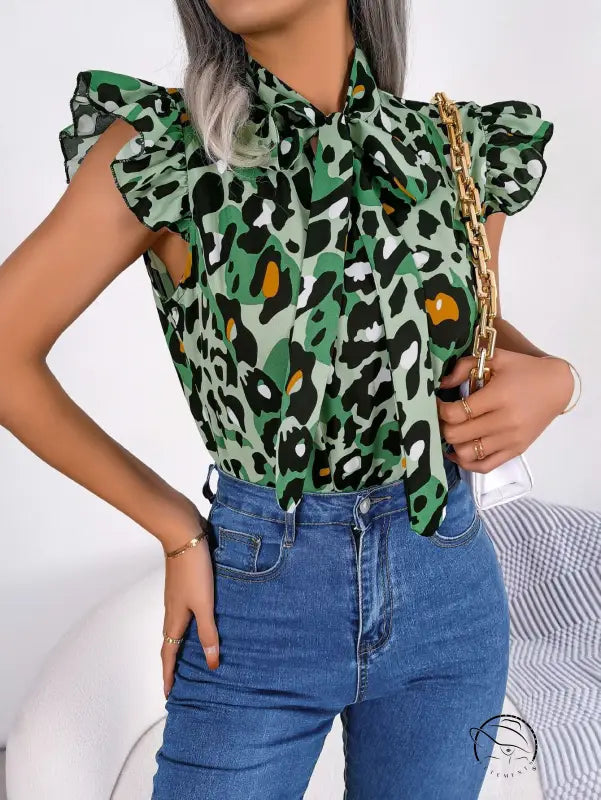 Casual leopard print blouse with pussy bow neckline and blue jeans
