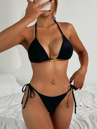 Black string bikini with gold-tone hardware detail, a must-have in ملابس fashion