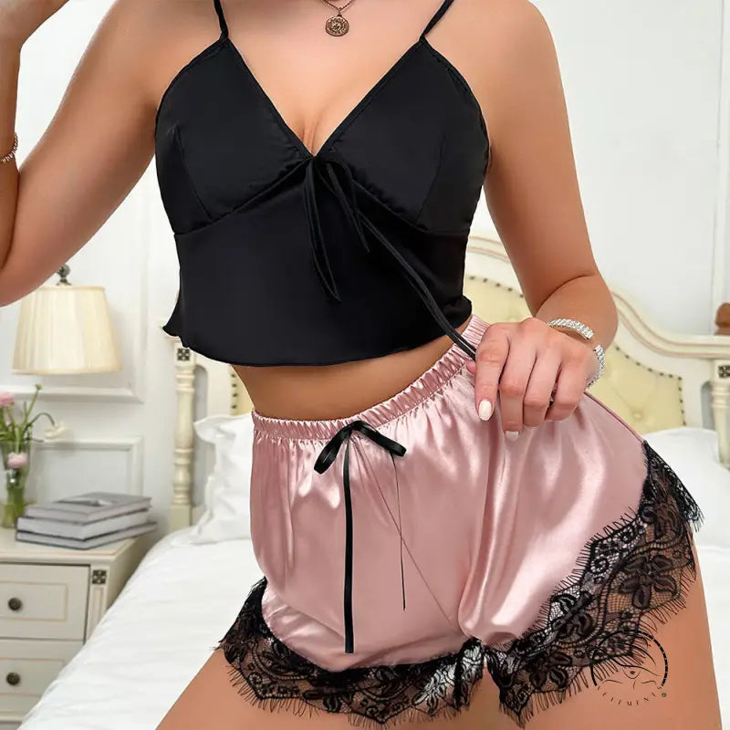 Black satin langry crop top with tie detail and pink shorts with lace trim