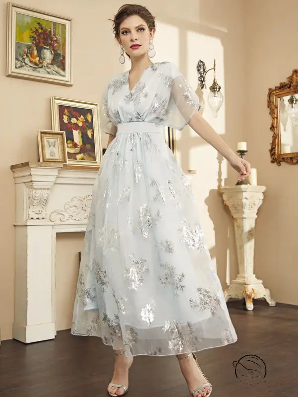 Elegant langry fashion midi dress in light blue with silver floral embroidery