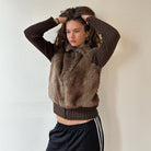Langry fashion brown fur vest with black ribbed sweater and Adidas track pants