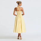 Langry yellow satin halter neck evening maxi dress with bow back detail
