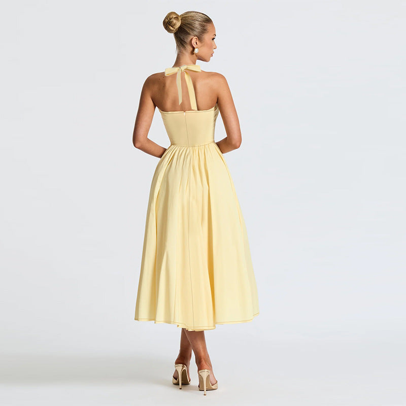 Langry yellow satin halter neck evening maxi dress with bow back detail