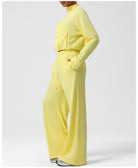 Langry fashion yellow jumpsuit with gold belt and wide-leg pants
