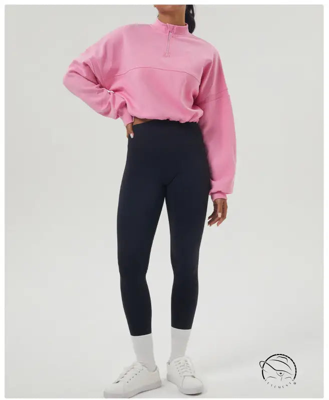Woman in pink autumn winter thickened sweater and black leggings