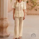 Cream-colored crochet beach loose shirt and casual trousers set