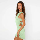 Light green mini dress with back cutouts, perfect for summer fashion and ملابس styling
