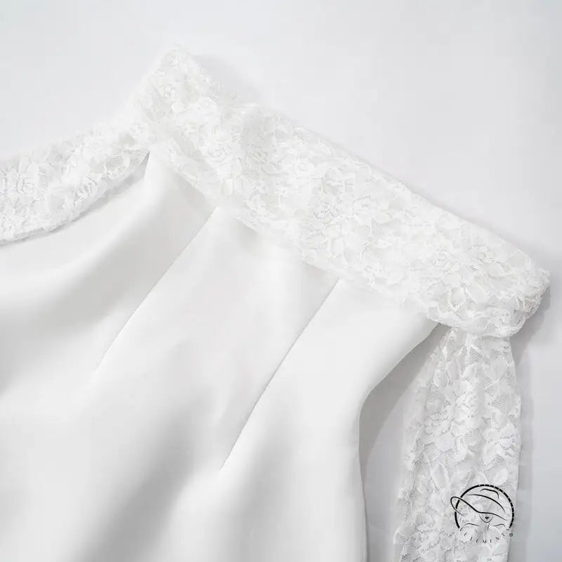 Elegant A-line dress in white with delicate lace trim