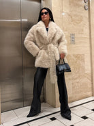 Langry faux fur fox coat with shearling, leather pants, sunglasses