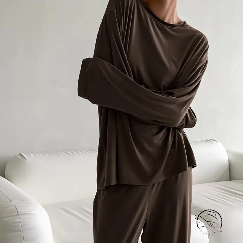 Woman in round neck knitted loose casual pajamas suit with long sleeves and pants