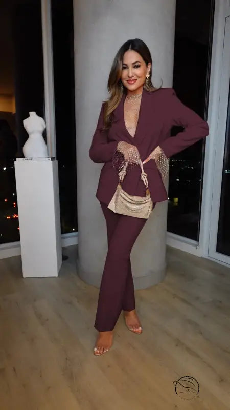 Woman in plum-colored suit from casual professional pants two piece set