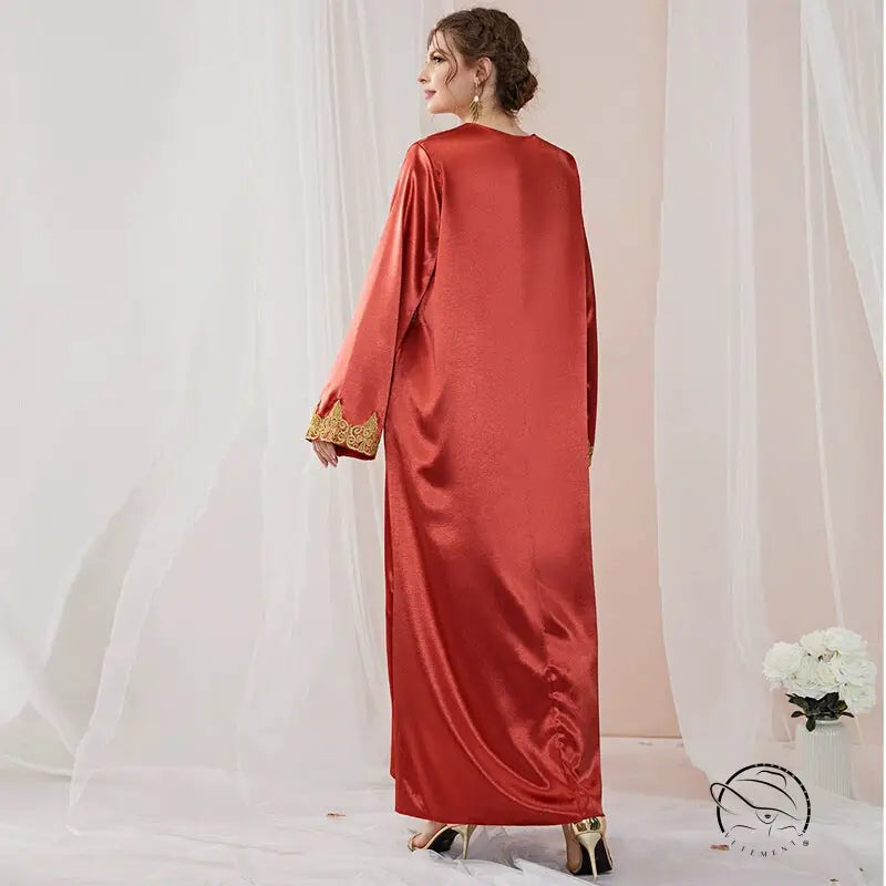 Elegant red satin abaya with gold embroidered cuffs in langry fashion