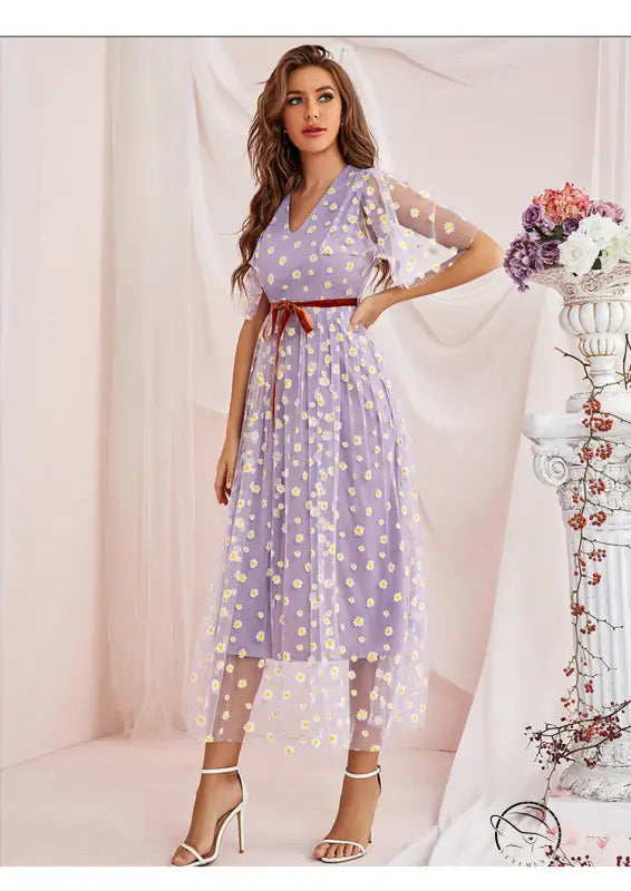 Enchanting langry fashion midi dress with lavender floral print, sheer overlay, red belt