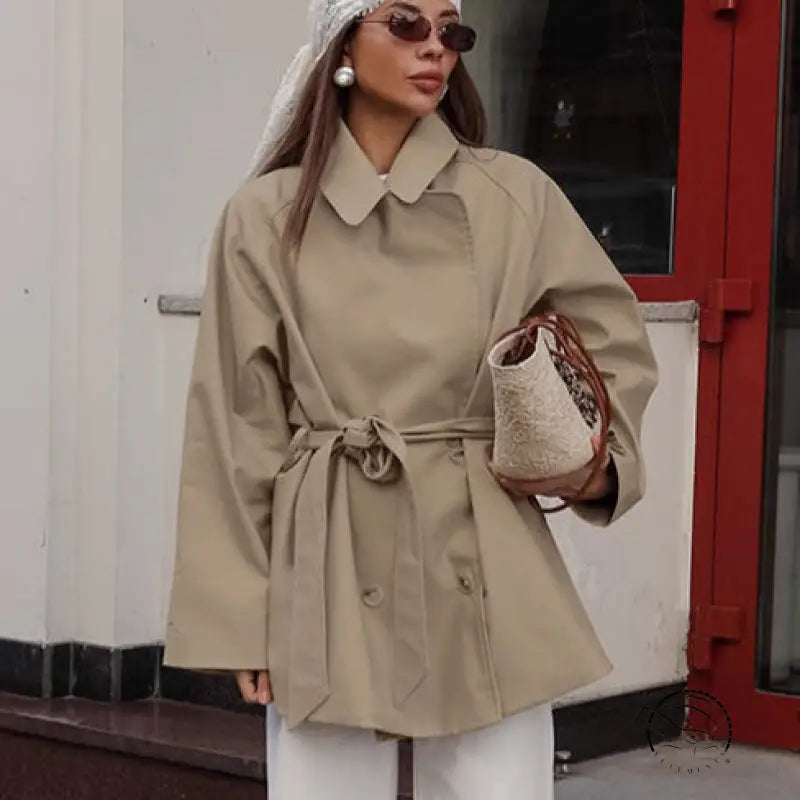 Beige trench coat with belt and button closure in Langry fashion ملابس