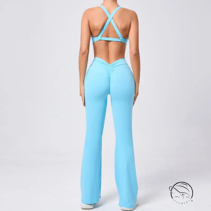 Light blue tight brushed yoga jumpsuit with peach hip raise crisscross back