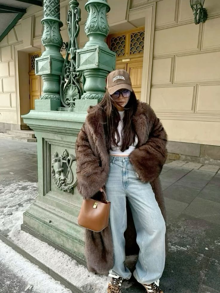 Brown faux fur Langry jacket with leather handbag and gold hardware