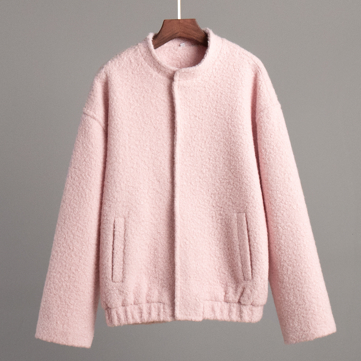 Pink textured bomber jacket featured in Pink Short Furry Coat showcasing stylish short furry design
