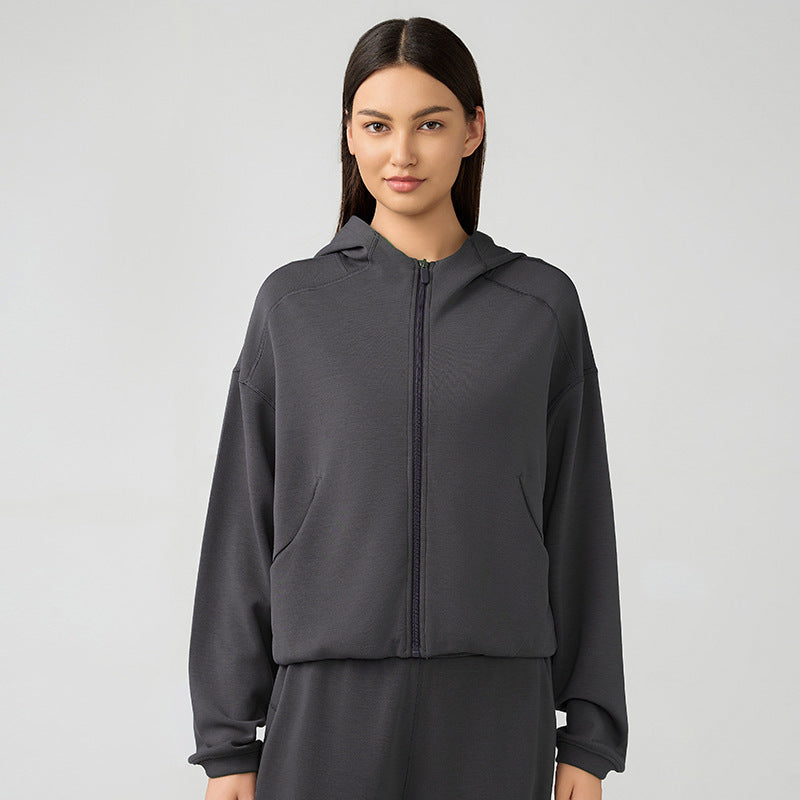 Gray zip-up hooded sweatshirt for women, ideal for fitness and autumn winter fashion