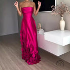 Stunning strapless fuchsia langry fashion gown with circular embellishments