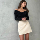 Langry fashion black off-shoulder top with ruched detailing and beige mini skirt