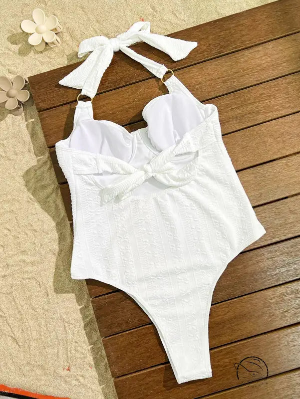 Elegant white embroidered halter-neck one-piece swimsuit with bow detail