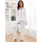 Women’s white long-sleeve pajama set with black piping, stylish homewear fashion