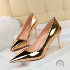 Shiny pair of fashionable gold stiletto heels