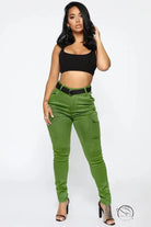 Woman in black crop top and casual skinny stretch belt sports pants