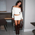 White off-shoulder crop top and mini skirt set with brown knee-high boots fashion ملابس