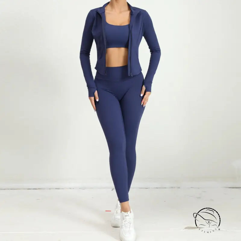 Navy blue three piece yoga clothes suit with cropped top, leggings, and zipper jacket