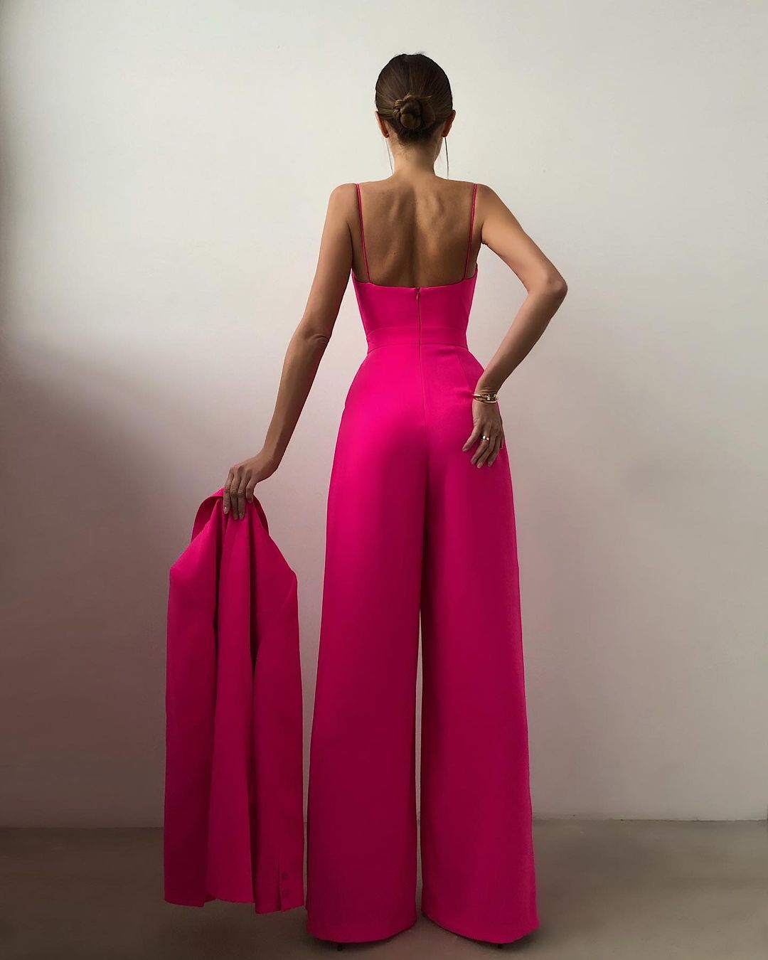 Hot pink strapless jumpsuit with wide-leg pants for elegant and modern fashion ملابس