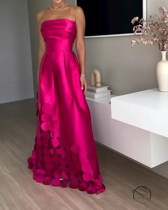 Stunning strapless fuchsia langry fashion gown with circular embellishments
