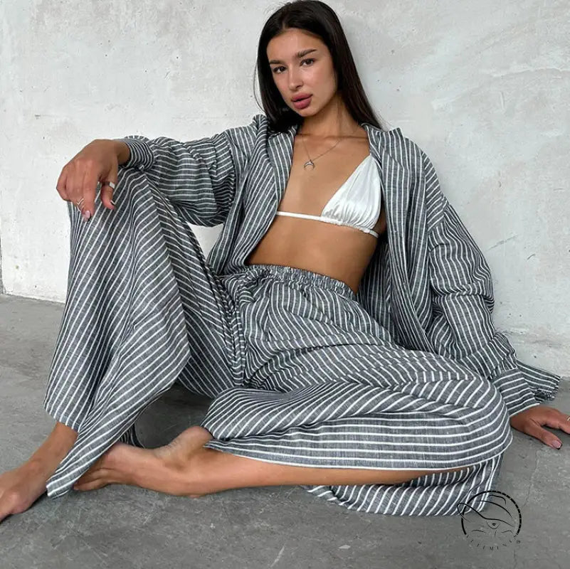 Woman in langry gray white striped wide-leg pajama set