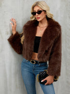 Brown faux fur cropped jacket with plush texture and long sleeves