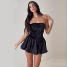 Elegant off the shoulder black sequined mini dress with flared skirt for fashionable occasions