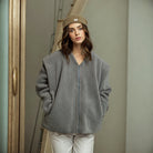 Woman in a gray fleece jacket showcasing stylish langry fashion for casual wear