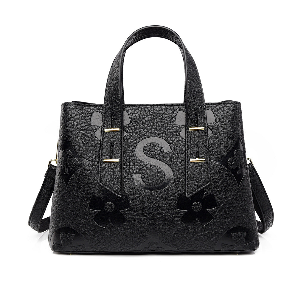 Langry fashion high-grade soft leather handbag with floral cutouts