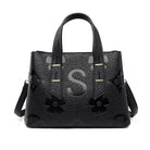 Langry fashion high-grade soft leather handbag with floral cutouts