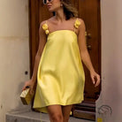 Yellow satin casual loose vacation dress with floral straps