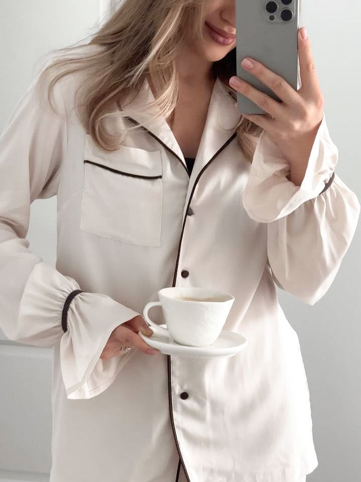 Langry white silk pajama set with black piping and buttons