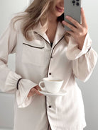 Langry white silk pajama set with black piping and buttons