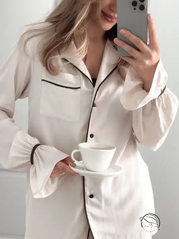 Elegant white silk langry pajamas with black piping and buttons