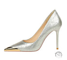 Silver metal pointed super high heel by Jimmy Choo with gold toe cap