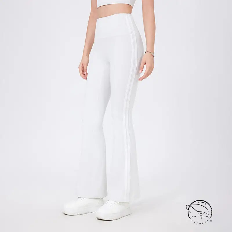 White high waist yoga pants with flared legs, peach hip raise design and side stripes
