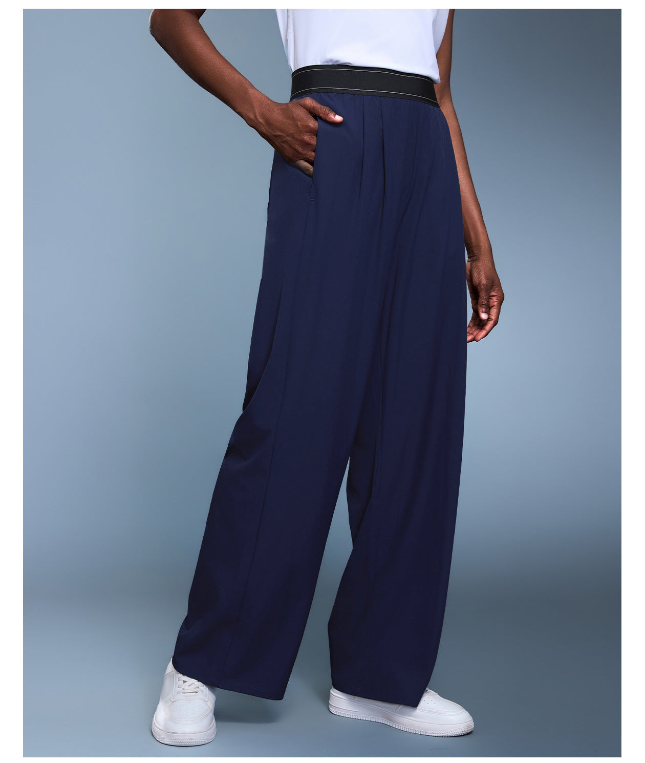 Navy blue langry fashion wide-leg trousers with black waistband and white sneakers