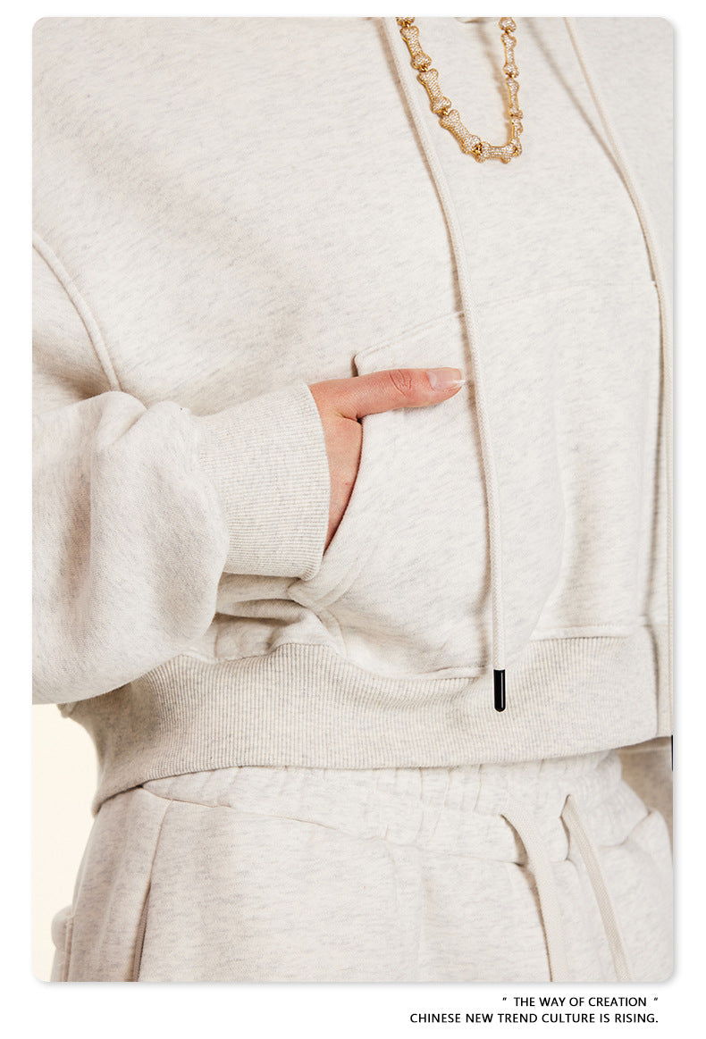 Cream-colored Winter Retro Hooded Pullover with wide sleeves and a gold chain necklace