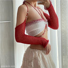 Red knit arm sleeves paired with a white top in an elegant sexy oversleeve knitted design