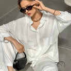 Woman in pure cotton cardigan loose pajamas with sunglasses and necklace